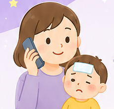 お子さんを抱いて電話するお母さん
